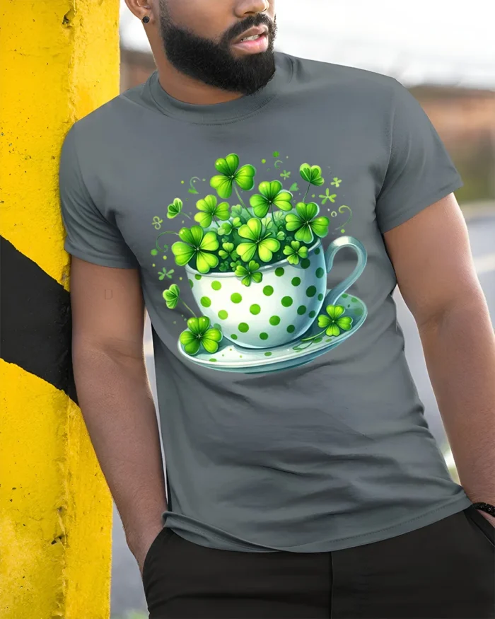 Lucky Shamrock Cup T-Shirt for St. Patrick’s Day Cheer - model in grey shirt leaning against column