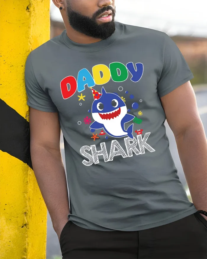 Daddy Shark Birthday T-Shirt for Family Party Fun - model in grey shirt leaning against column