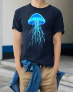 Glowing Blue Jellyfish T-Shirt for Ocean and Sea Lovers - model wearing navy shirt, hands in pockets