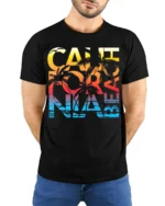 California Beach Sunset T-Shirt with Palm Tree Graphic - model wearing black shirt, hands behind back