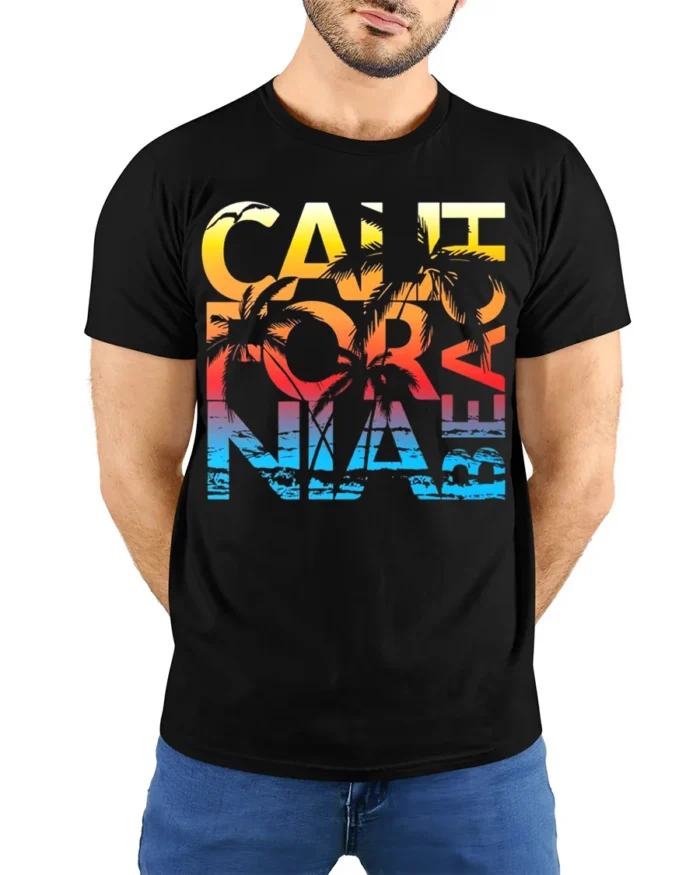 California Beach Sunset T-Shirt with Palm Tree Graphic - model wearing black shirt, hands behind back