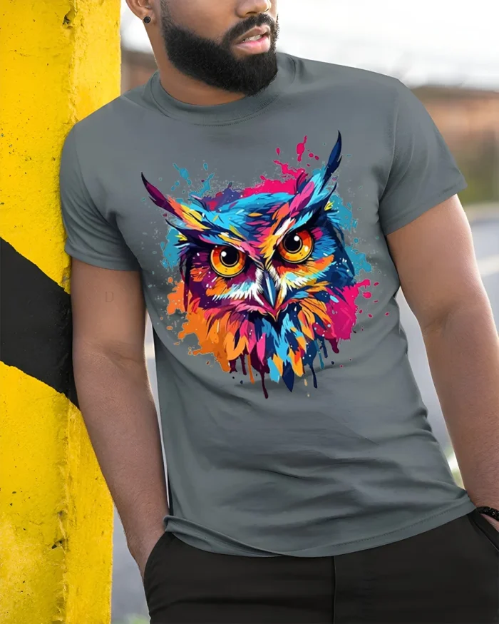 Color Splash Owl T-Shirt with Vibrant Artistic Design - model in grey shirt leaning against column