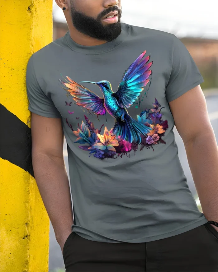 Vibrant Hummingbird and Flowers T-Shirt for Nature Lovers - model in grey shirt leaning against column
