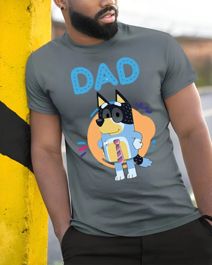 Cute Cartoon Dog Dad T-Shirt for Father’s Day Gift Idea - model in grey shirt leaning against column
