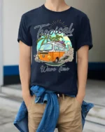 Tropical Beach Surf Van T-Shirt with Vintage Summer Vibe - model wearing navy shirt, hands in pockets