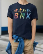 Retro BMX Trick T-Shirt Colorful Bike Rider Silhouette - model wearing navy shirt, hands in pockets