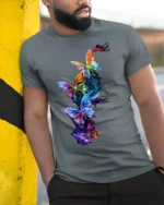 Colorful Butterfly Galaxy T-Shirt with Vibrant Art Print - model in grey shirt leaning against column