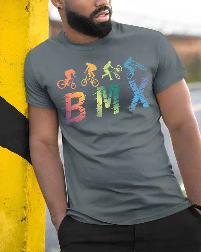 Retro BMX Trick T-Shirt Colorful Bike Rider Silhouette - model in grey shirt leaning against column