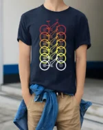 Retro Gradient Bicycle Pattern Graphic T-Shirt Unisex - model wearing navy shirt, hands in pockets