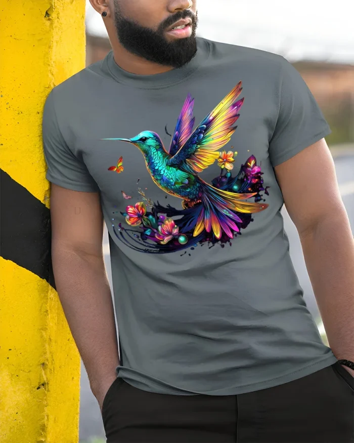 Colorful Hummingbird Floral Graphic T-Shirt for Nature Fans - model in grey shirt leaning against column