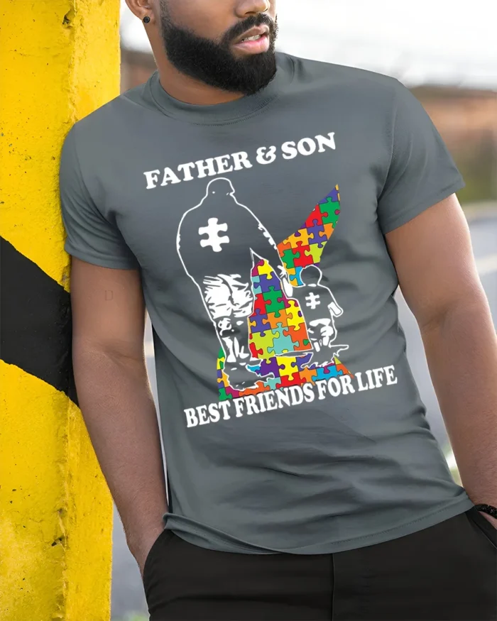Father Son Best Friends Puzzle Autism Support T-Shirt - model in grey shirt leaning against column