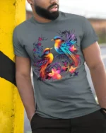 Colorful Birds and Flowers Art T-Shirt for Nature Lovers - model in grey shirt leaning against column