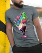 Exploding Lightbulb T-Shirt Neon Creative Burst - model in grey shirt leaning against column