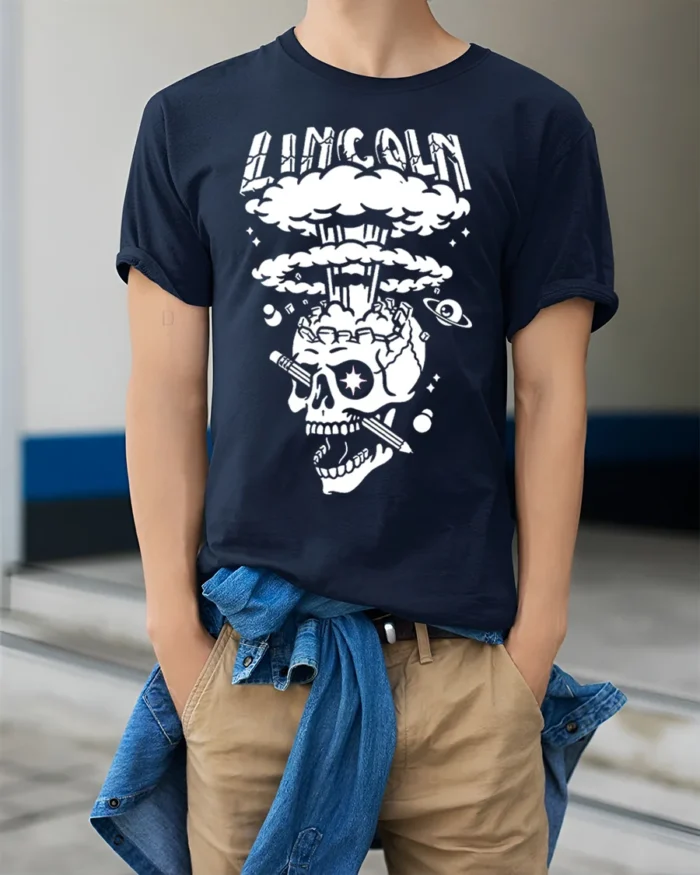Lincoln Skull Explosion T-Shirt Bold Graphic Art - model wearing navy shirt, hands in pockets