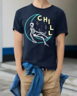 Chill Skeleton Moon T-Shirt Relaxed Cosmic Vibe - model wearing navy shirt, hands in pockets