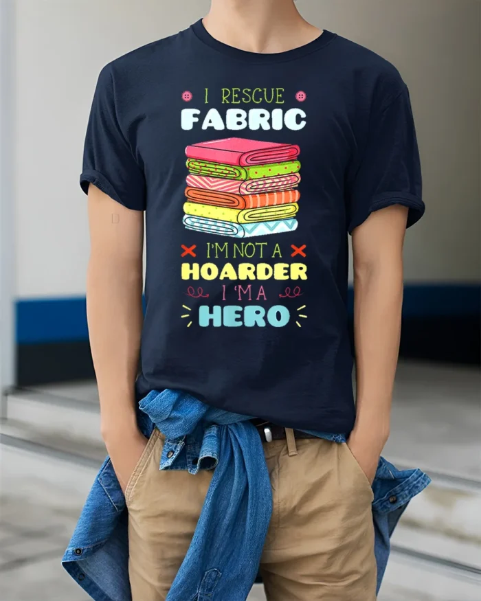 I Rescue Fabric T-Shirt Funny Sewing Hoarder Hero - model wearing navy shirt, hands in pockets