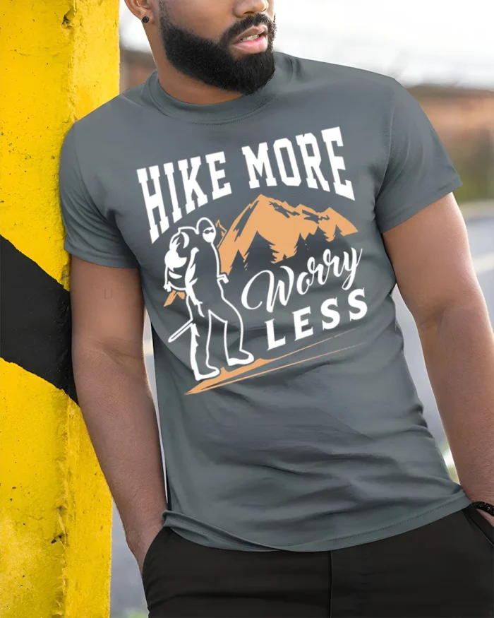 Hike More Worry Less T-Shirt Comfortable Hiking - model in grey shirt leaning against column
