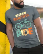 Life Is a Beautiful Ride T-Shirt Vintage Bike Tee - model in grey shirt leaning against column