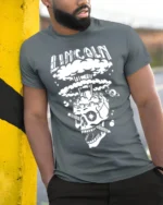 Lincoln Skull Explosion T-Shirt Bold Graphic Art - model in grey shirt leaning against column