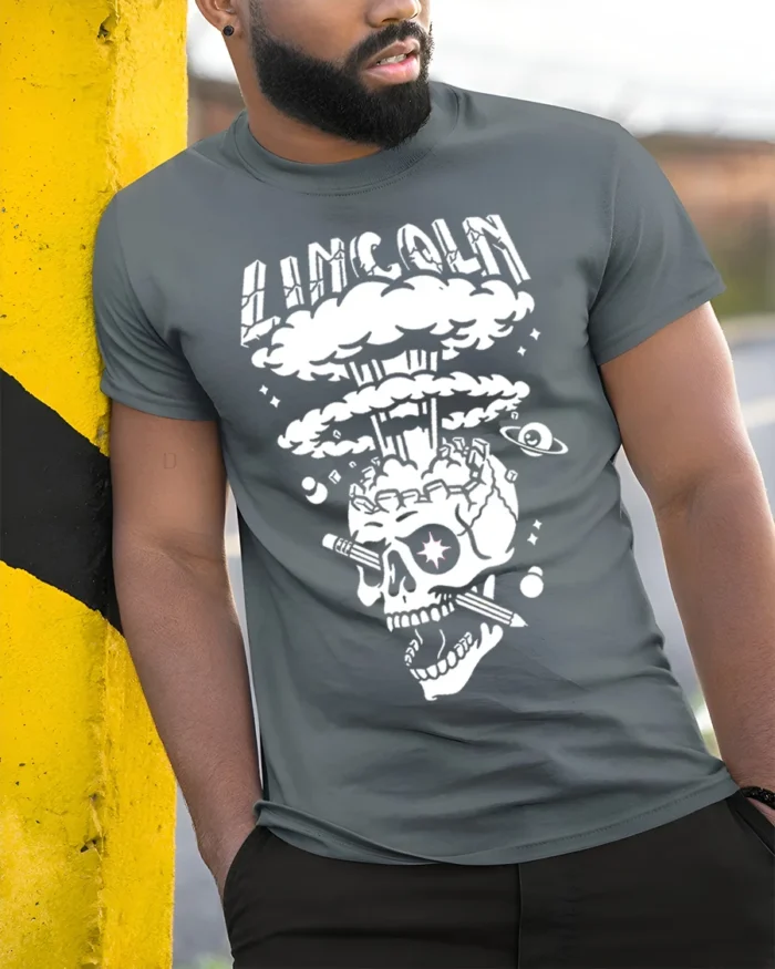 Lincoln Skull Explosion T-Shirt Bold Graphic Art - model in grey shirt leaning against column
