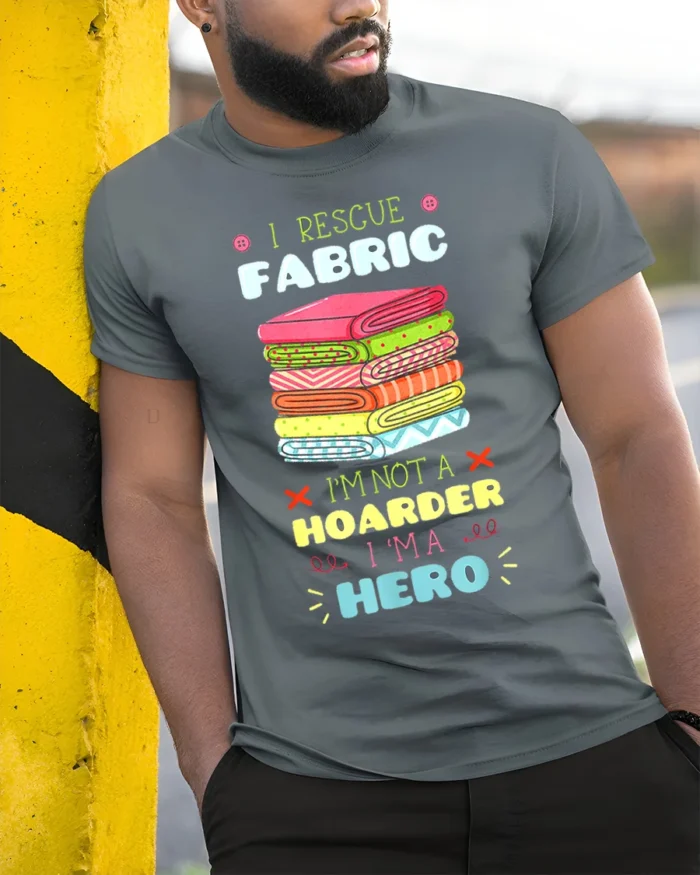 I Rescue Fabric T-Shirt Funny Sewing Hoarder Hero - model in grey shirt leaning against column