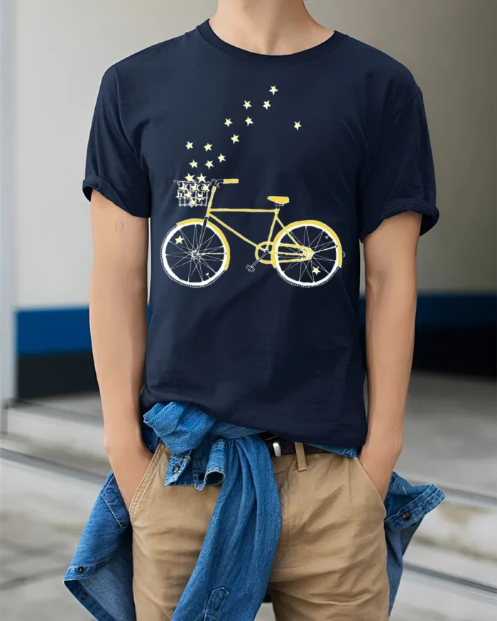 Starry Bicycle Ride T-Shirt Dreamy Bike Graphic - model wearing navy shirt, hands in pockets