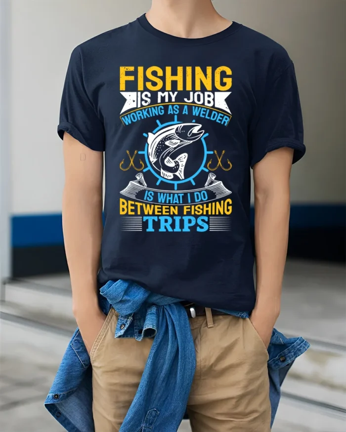 Fishing Is My Job T-Shirt Welder Between Fishing Trips - model wearing navy shirt, hands in pockets