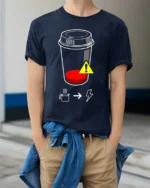 Low Battery Coffee T-Shirt Caffeine Power Graphic - model wearing navy shirt, hands in pockets