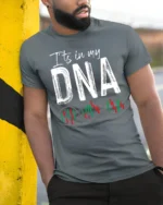Itβs In My DNA Stock Trading T-Shirt Soft Cotton Tee - model in grey shirt leaning against column