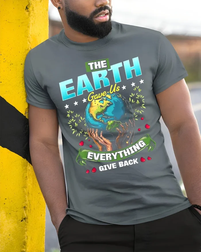 The Earth Gave Us Everything T-Shirt Give Back Message - model in grey shirt leaning against column
