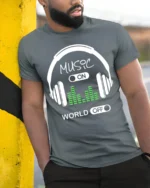 Music On World Off T-Shirt Headphones Audio Graphic - model in grey shirt leaning against column