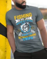 Fishing Is My Job T-Shirt Welder Between Fishing Trips - model in grey shirt leaning against column