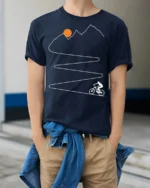 Mountain Climb Cycling Path Graphic T-Shirt for Men - model wearing navy shirt, hands in pockets