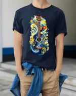 Artistic Floral Guitar T-Shirt Boho Music Lover Tee - model wearing navy shirt, hands in pockets