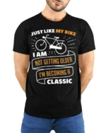 Funny Bike T-Shirt Not Getting Older Iām Classic Tee - model wearing black shirt, hands behind back