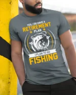 Fishing Retirement Plan T-Shirt Funny Gift for Fishermen - model in grey shirt leaning against column