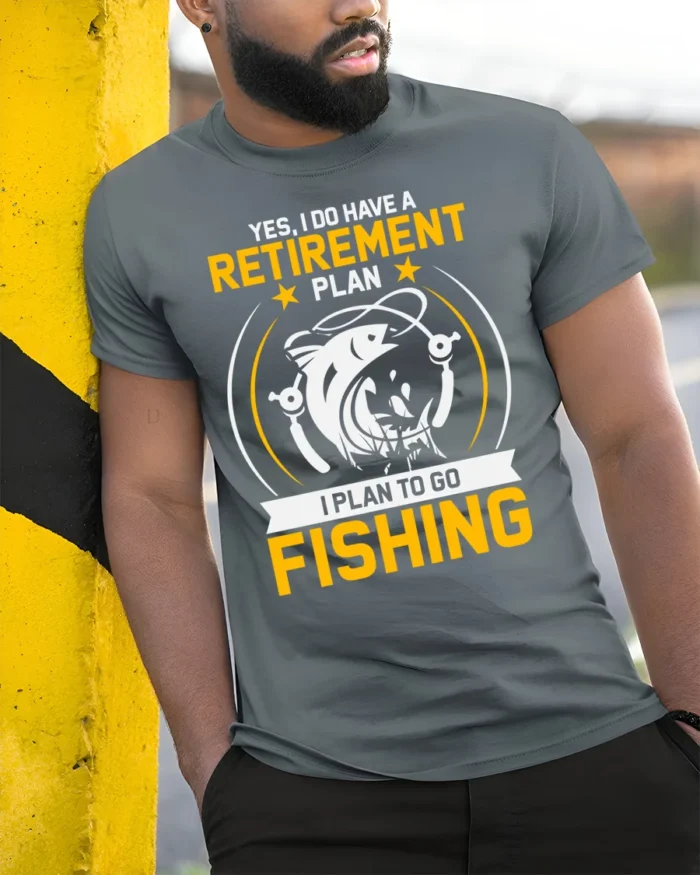 Fishing Retirement Plan T-Shirt Funny Gift for Fishermen - model in grey shirt leaning against column