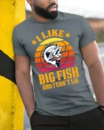 Funny Fishing T-Shirt I Like Big Fish and I Can’t Lie - model in grey shirt leaning against column