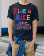 Ride a Bike T-Shirt Colorful Cycling Graphic Tee - model wearing navy shirt, hands in pockets