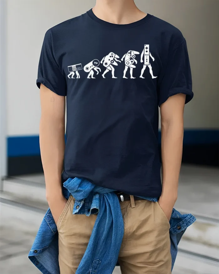 Evolution of Gaming Controllers T-Shirt Retro Gamer Tee - model wearing navy shirt, hands in pockets