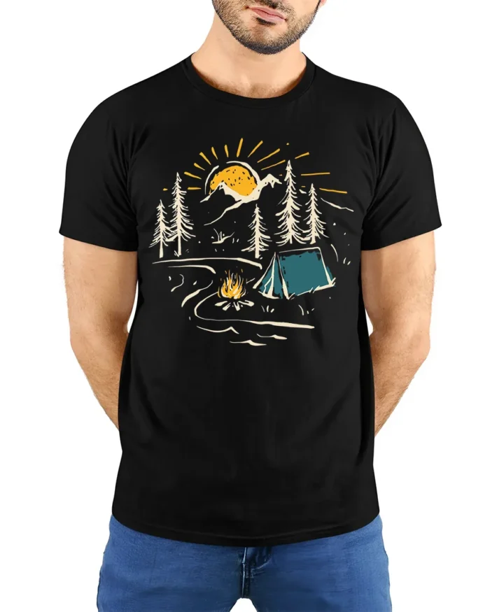 Sunset Camping Scene T-Shirt Cozy Campfire Forest Tee - model wearing black shirt, hands behind back