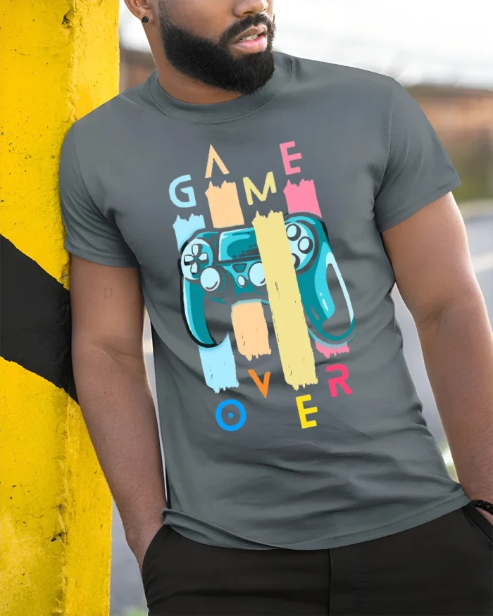 Game Over Controller T-Shirt Funny Gamer Graphic Tee - model in grey shirt leaning against column