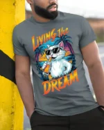 Living The Dream Cat T-Shirt Cool Beach Vibes Tee - model in grey shirt leaning against column