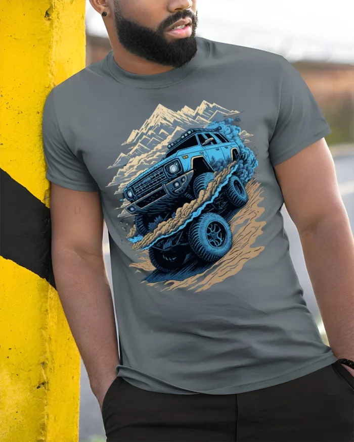 Off-Road Monster Truck T-Shirt Rugged Adventure Tee - model in grey shirt leaning against column