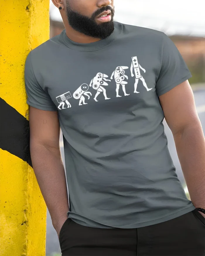 Evolution of Gaming Controllers T-Shirt Retro Gamer Tee - model in grey shirt leaning against column