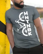 MTNBK Mountain Bike T-Shirt Bold MTB Graphic Tee - model in grey shirt leaning against column