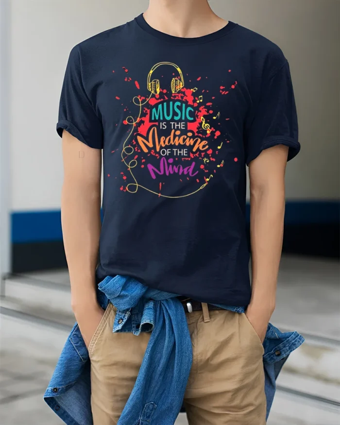 Music Is the Medicine of the Mind T-Shirt Soft Cotton - model wearing navy shirt, hands in pockets
