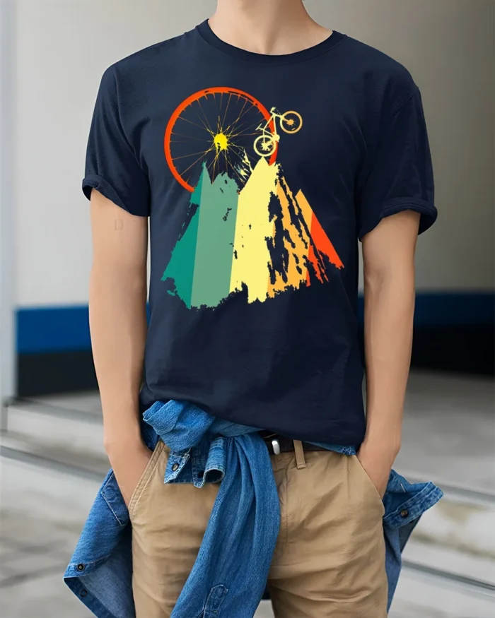 Mountain Biking Adventure Graphic T-Shirt - model wearing navy shirt, hands in pockets