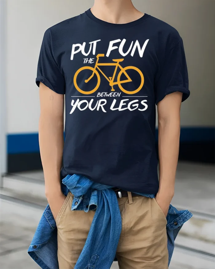 Funny Bicycle Rider Graphic T-Shirt Put Fun Between Legs - model wearing navy shirt, hands in pockets