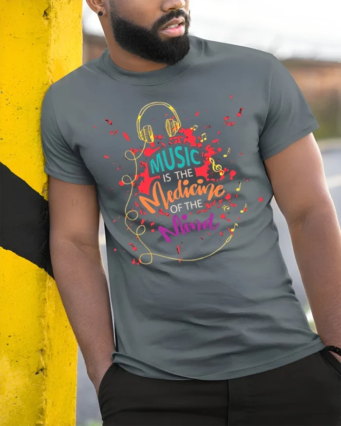 Music Is the Medicine of the Mind T-Shirt Soft Cotton - model in grey shirt leaning against column